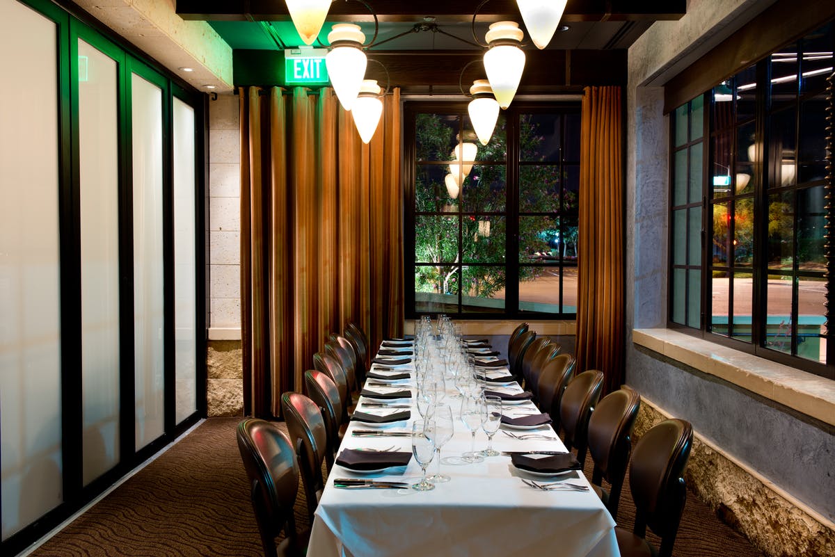 a dining room table in front of a window