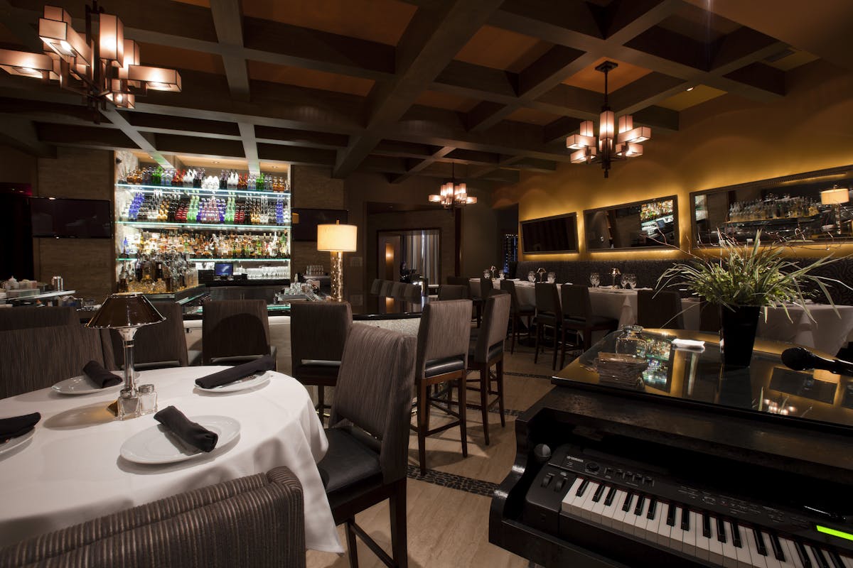 a piano in a dining room