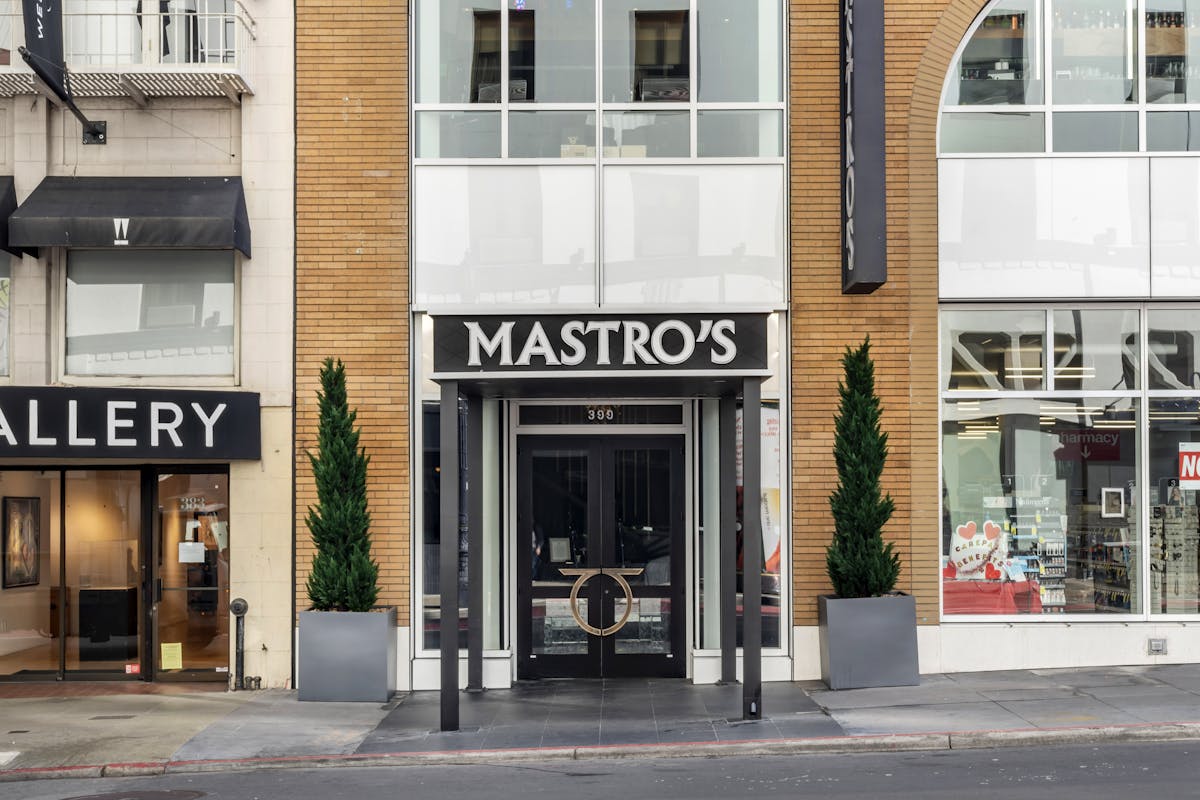 a building with a store on the corner of a street