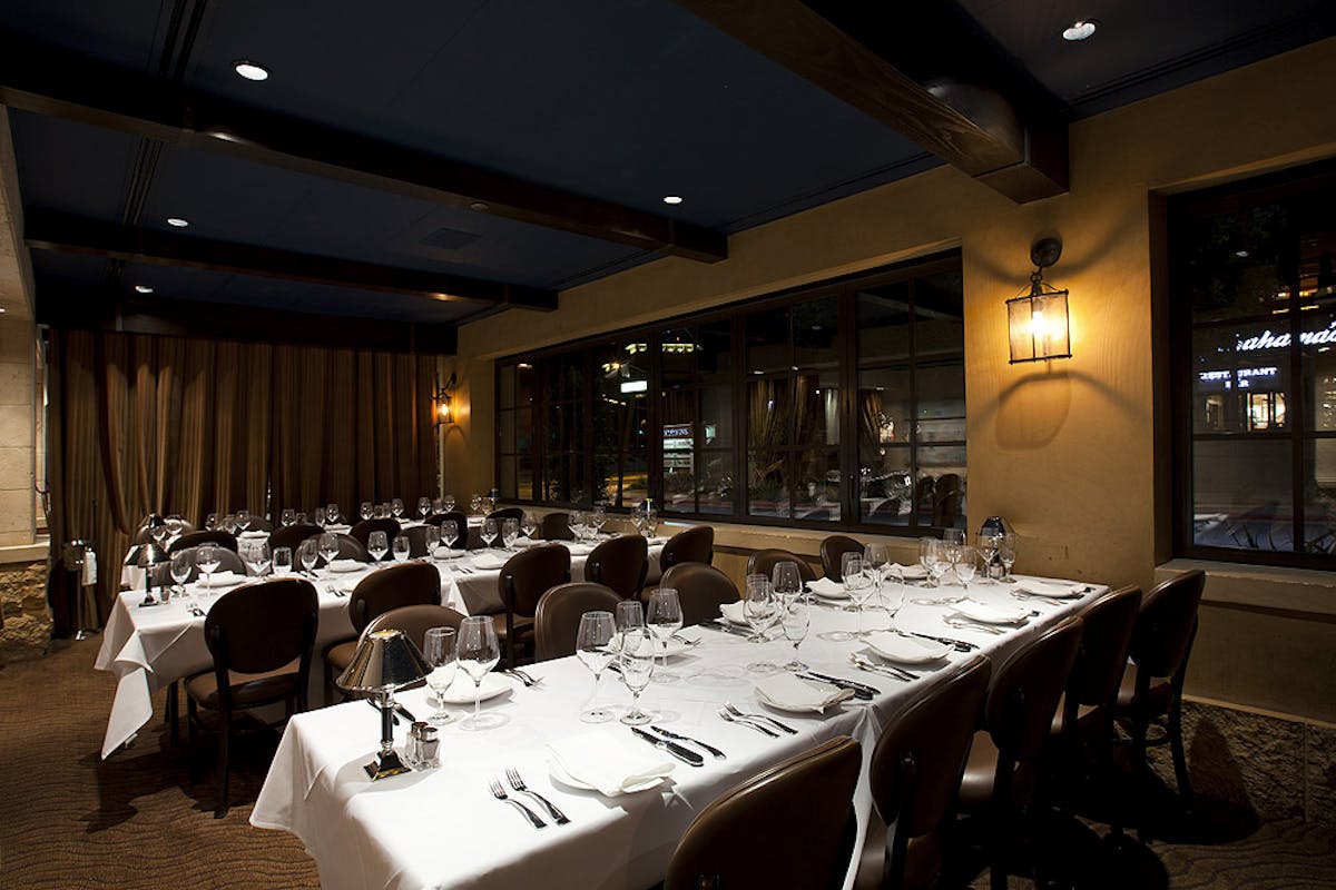 a room filled with furniture and a table in a restaurant