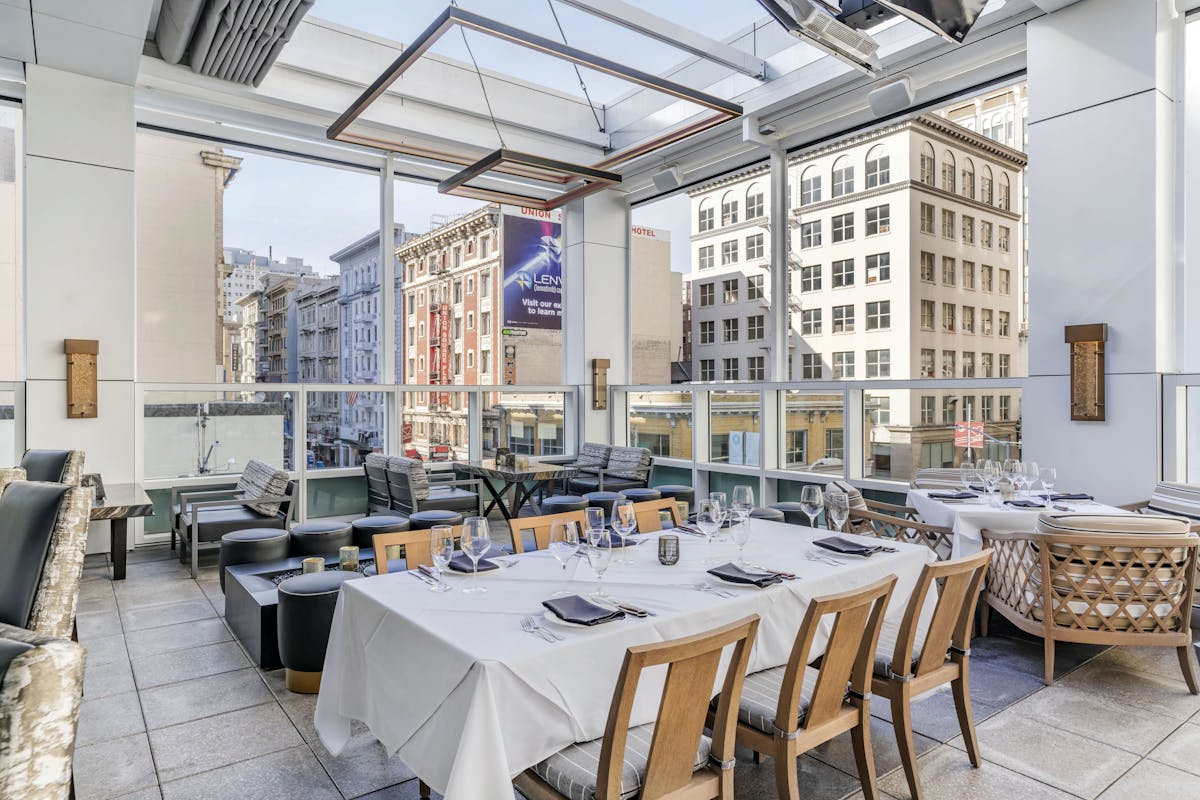 a dining room table in front of a building