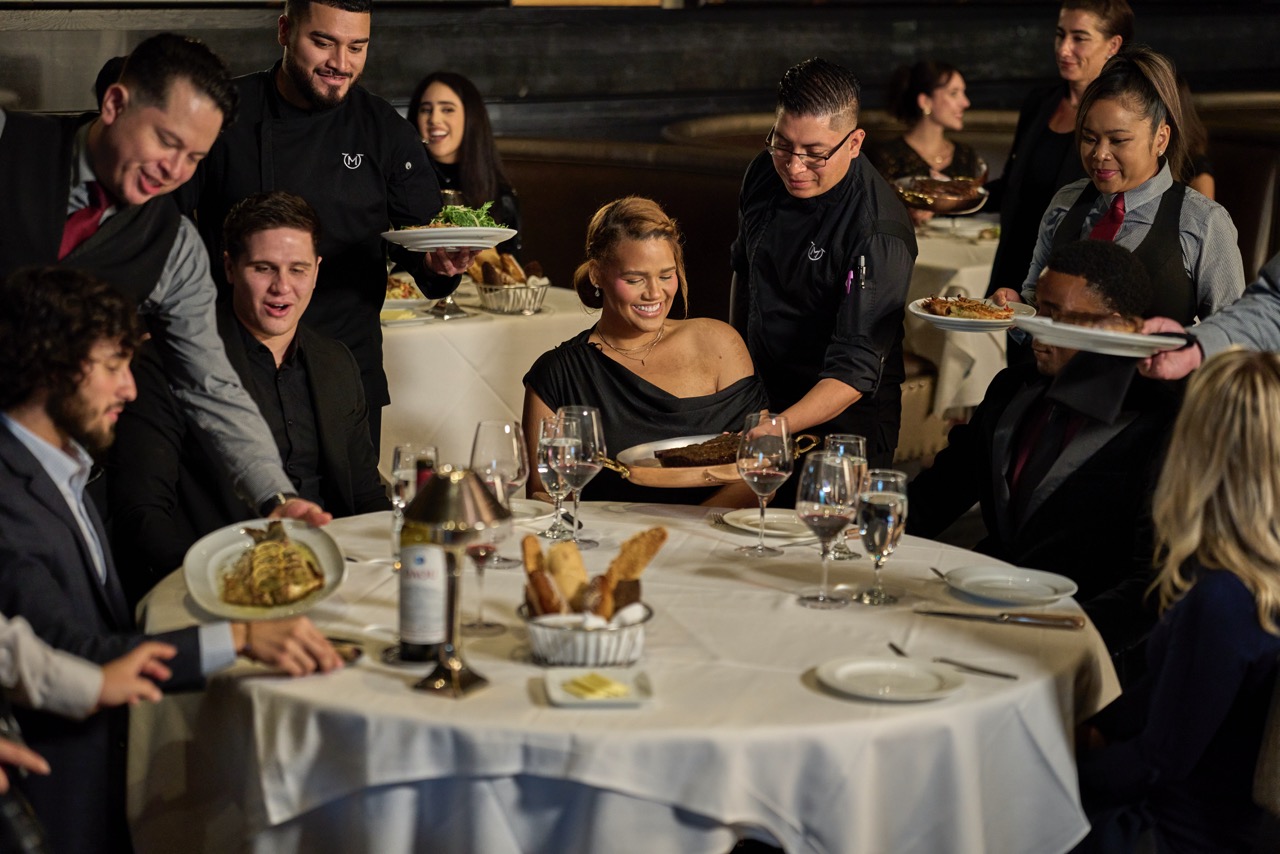 a group of people sitting at a table