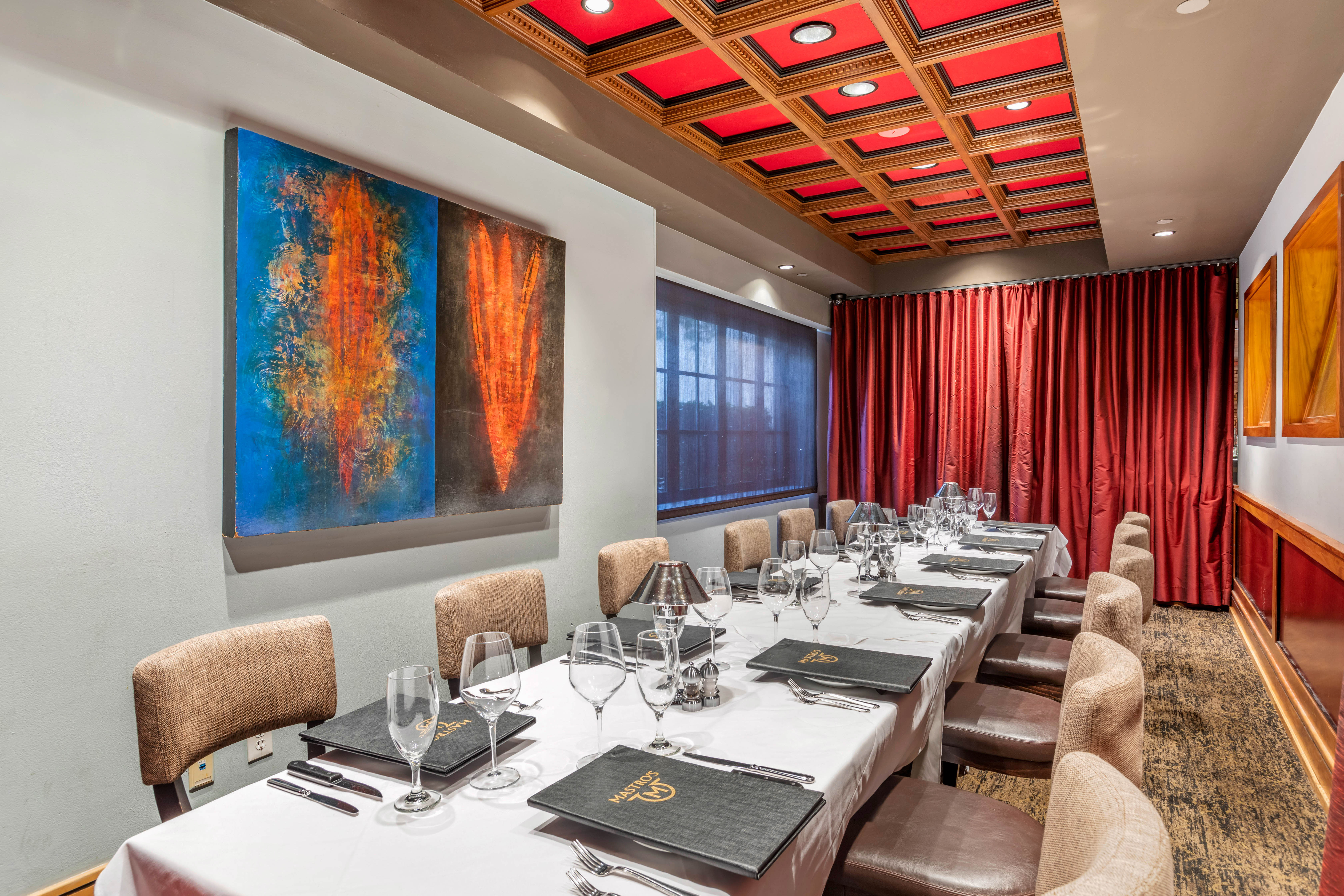 a bedroom with a bed and a chair in a room