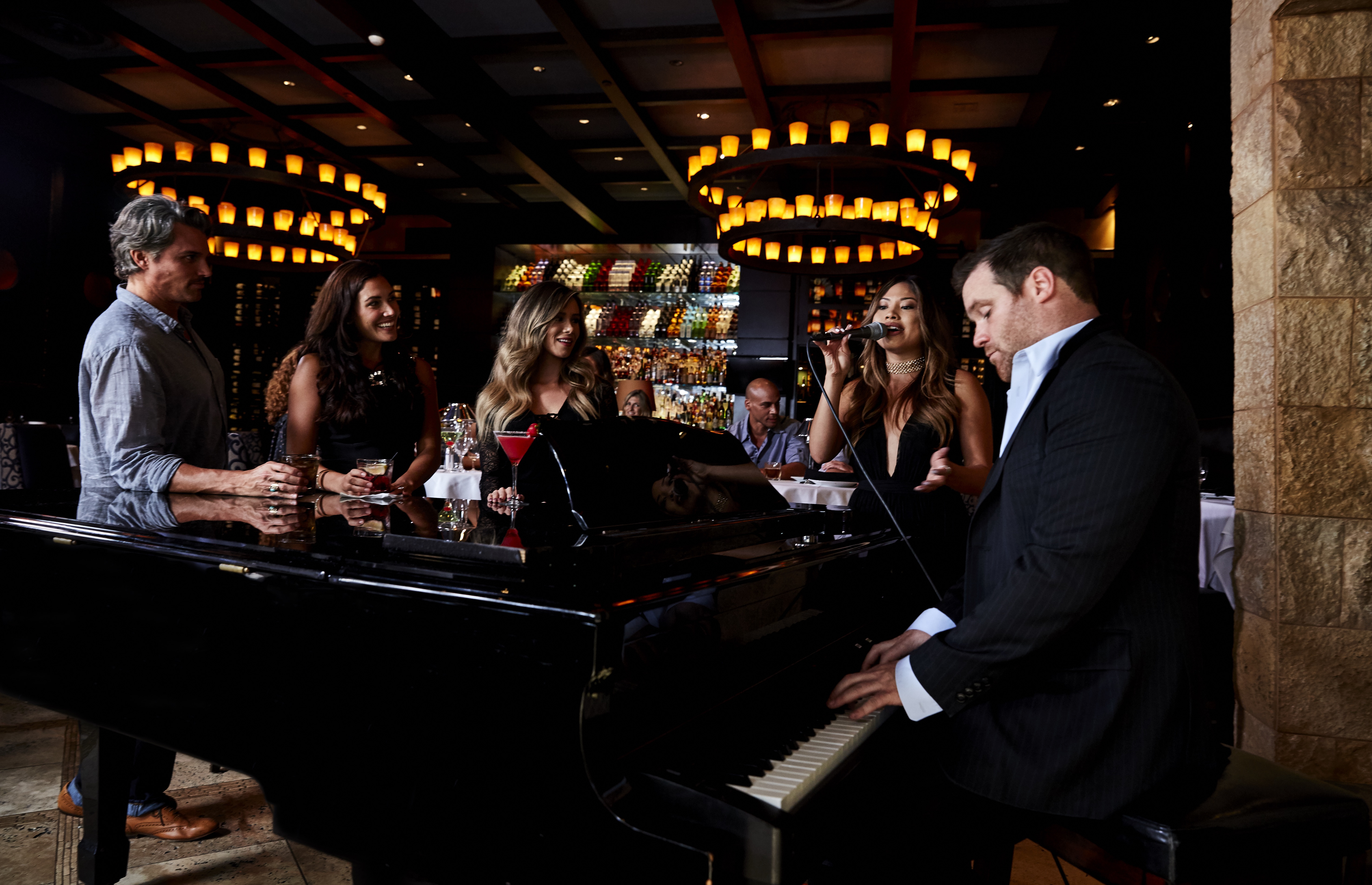 a group of people at a bar