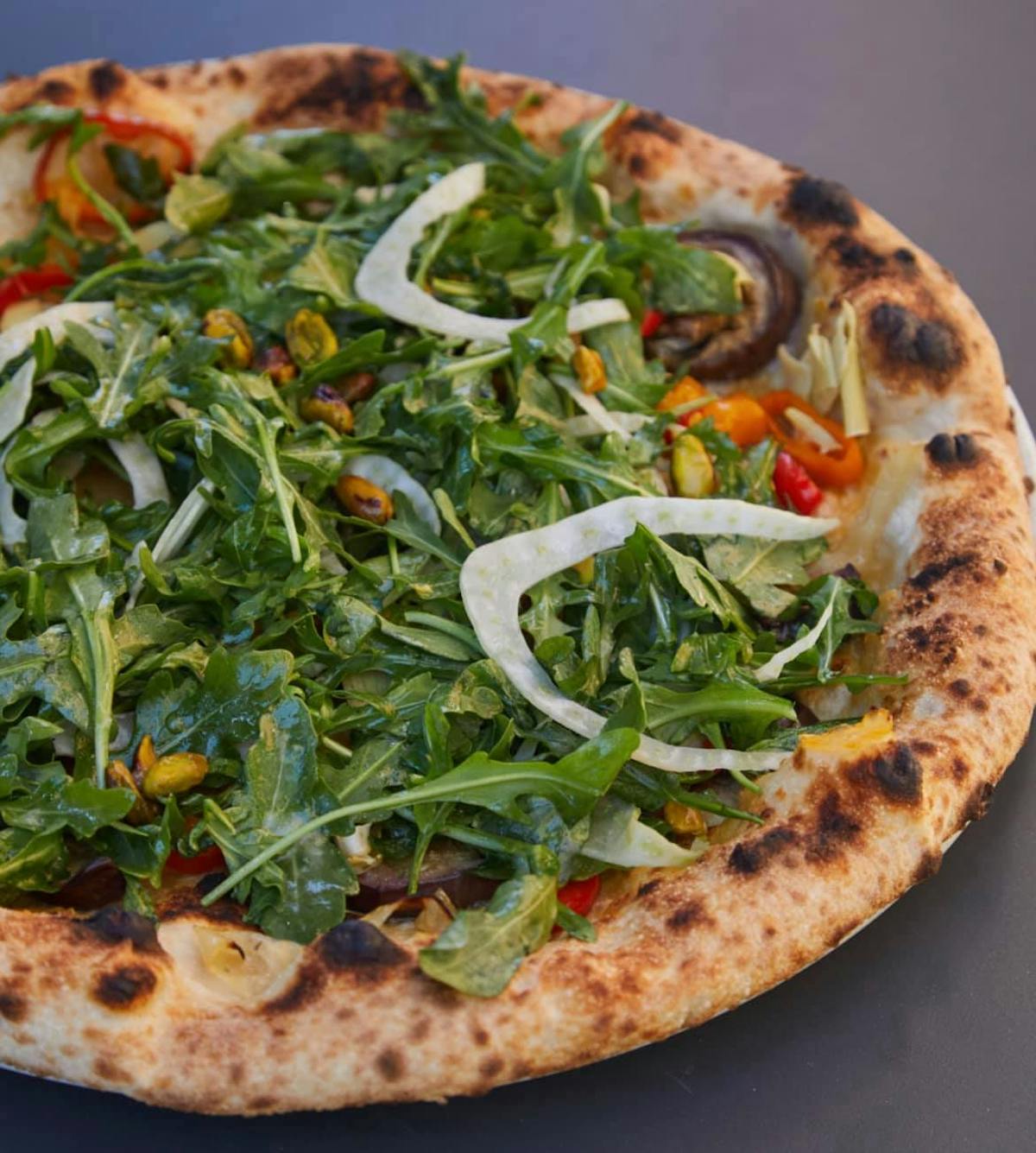 a pizza sitting on top of a table