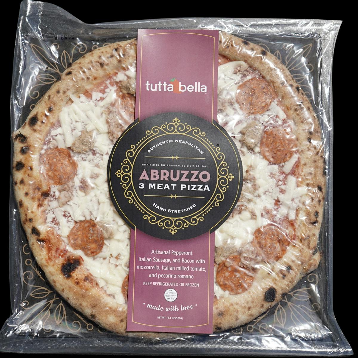 a pizza sitting on top of a pan on a table