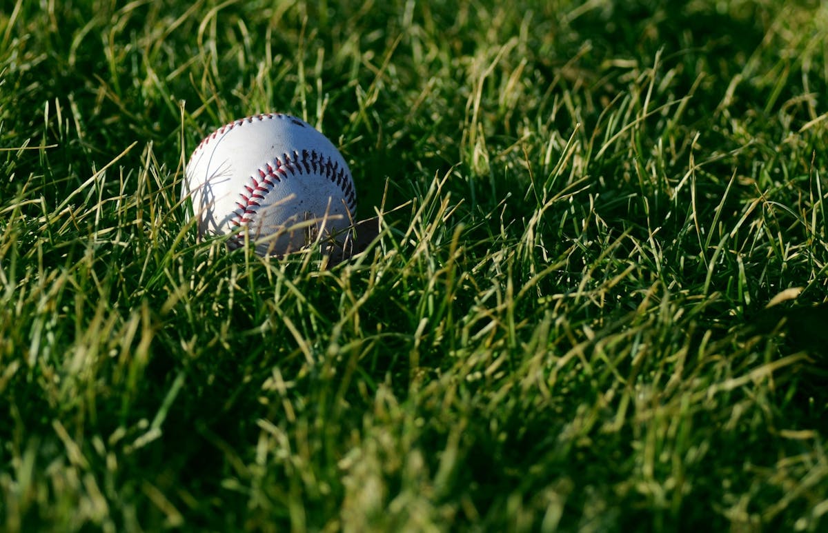 a close up of a football ball on a baseball field