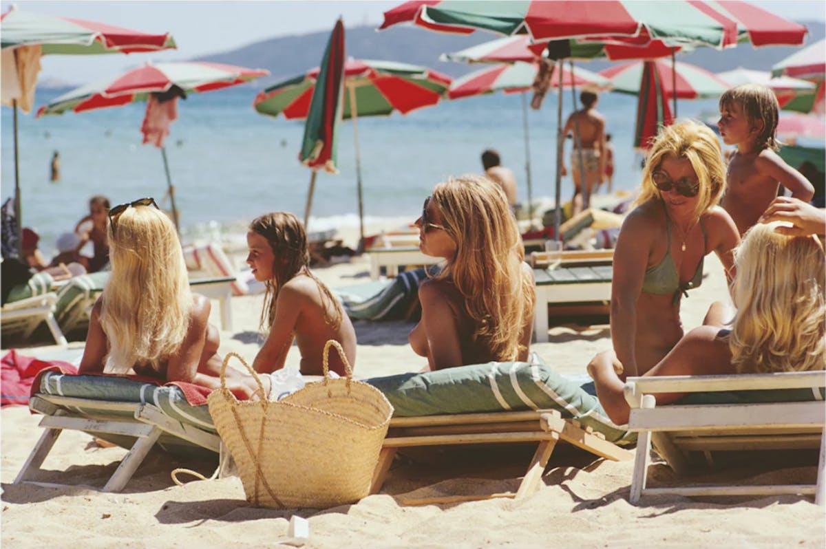 a group of people sitting at a picnic table