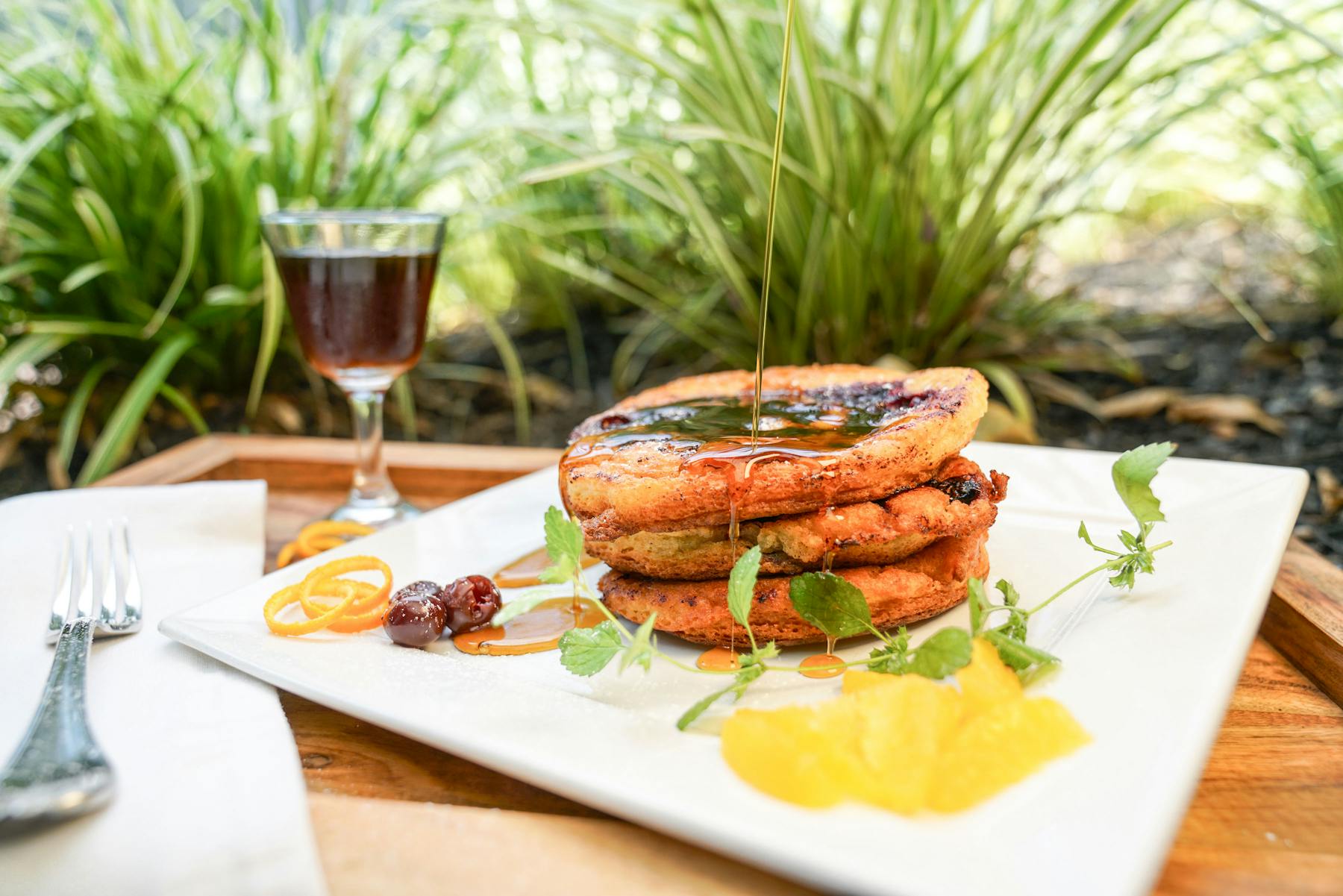 a plate of food sitting on top of a wooden table
