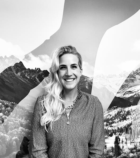 a person standing in front of a mountain