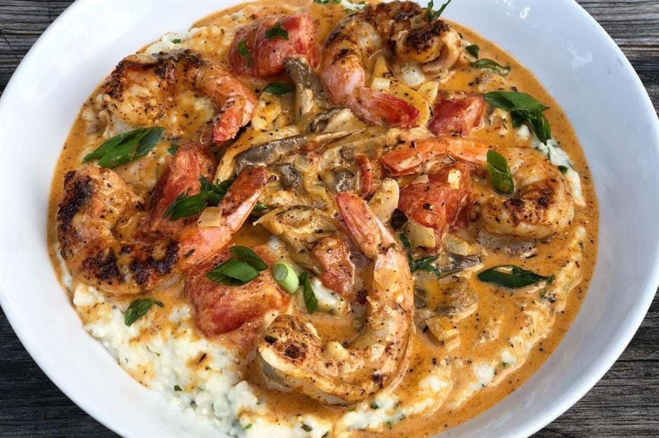 a pizza sitting on top of a plate of food