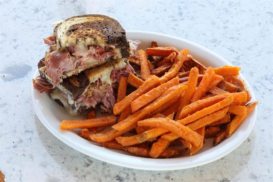 a sandwich and fries on a plate