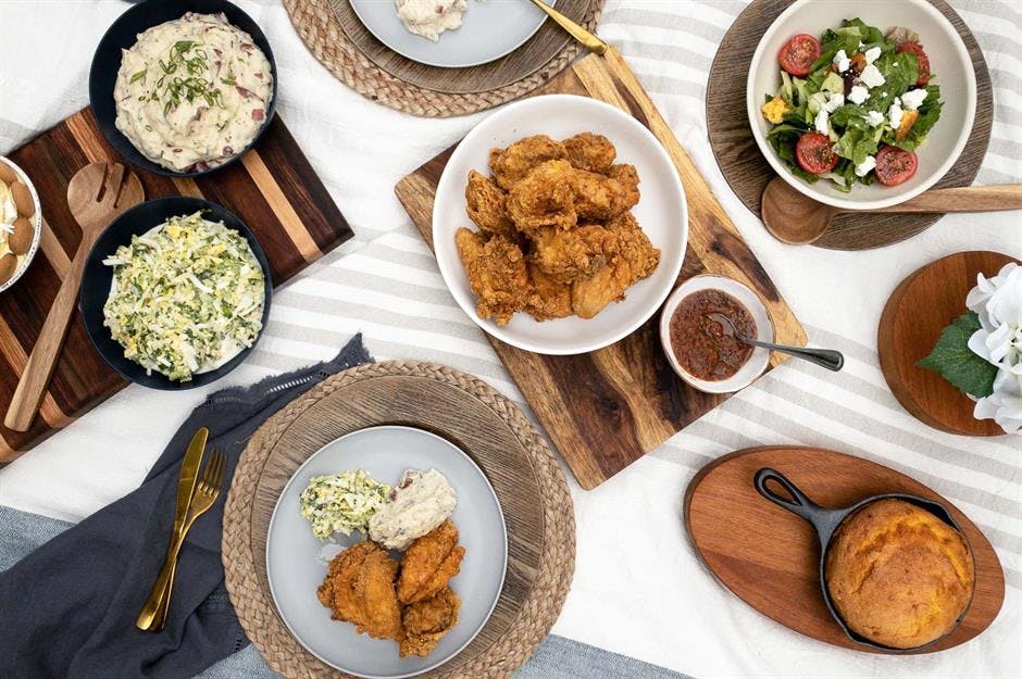 a bunch of food sitting on top of a wooden table