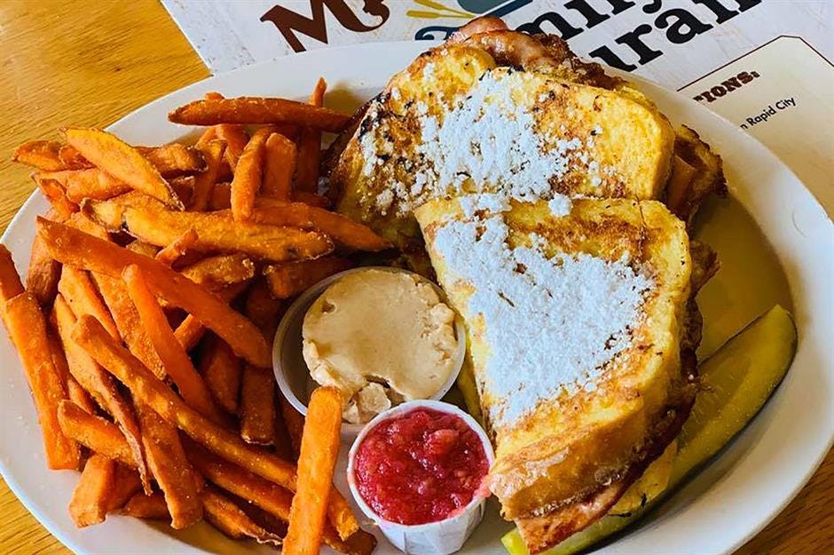 a plate of hot dogs and french fries