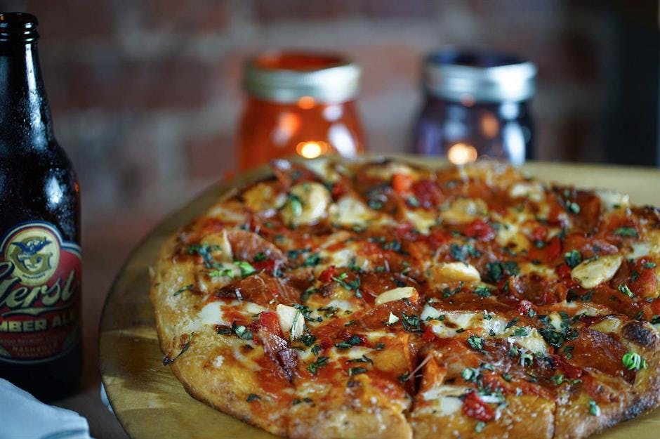 a pizza sitting on top of a table