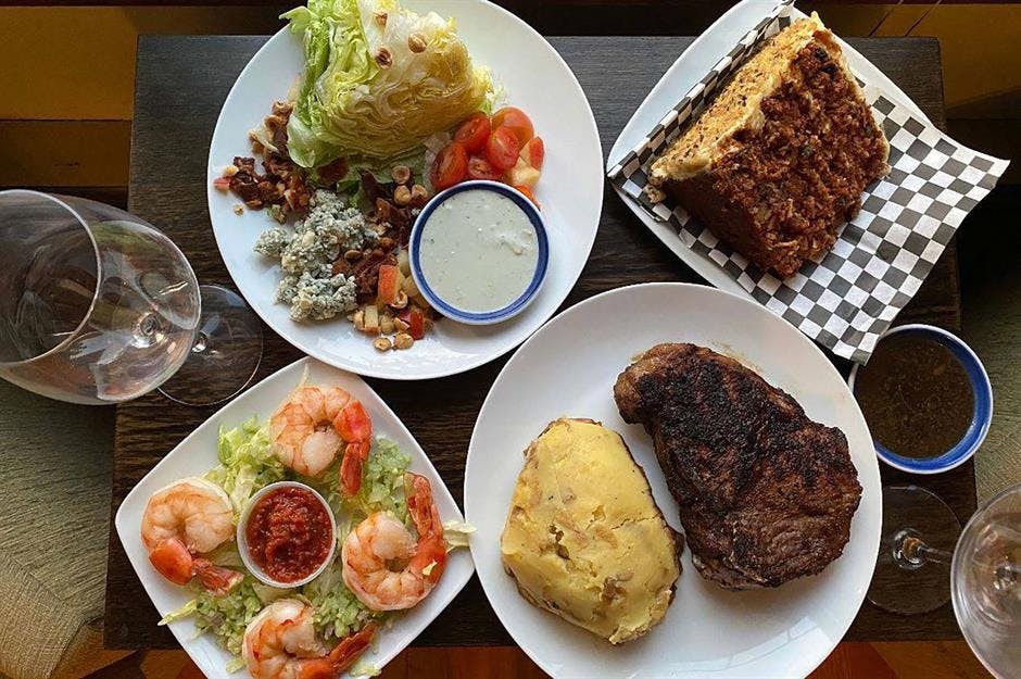 a plate is filled with different types of food on a table