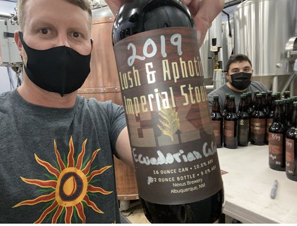 a person holding a bottle of wine
