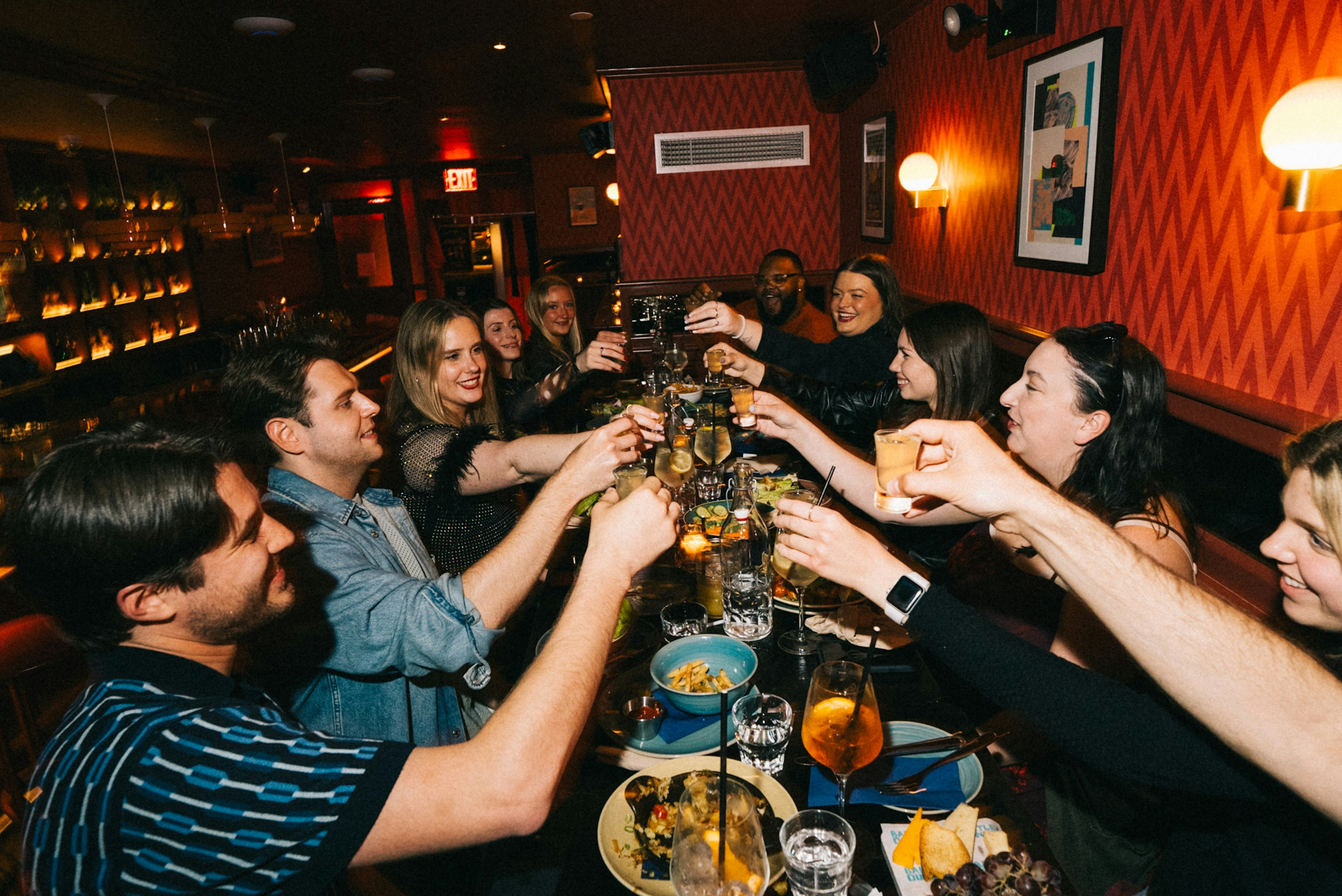 a group of people drinking wine at a restaurant