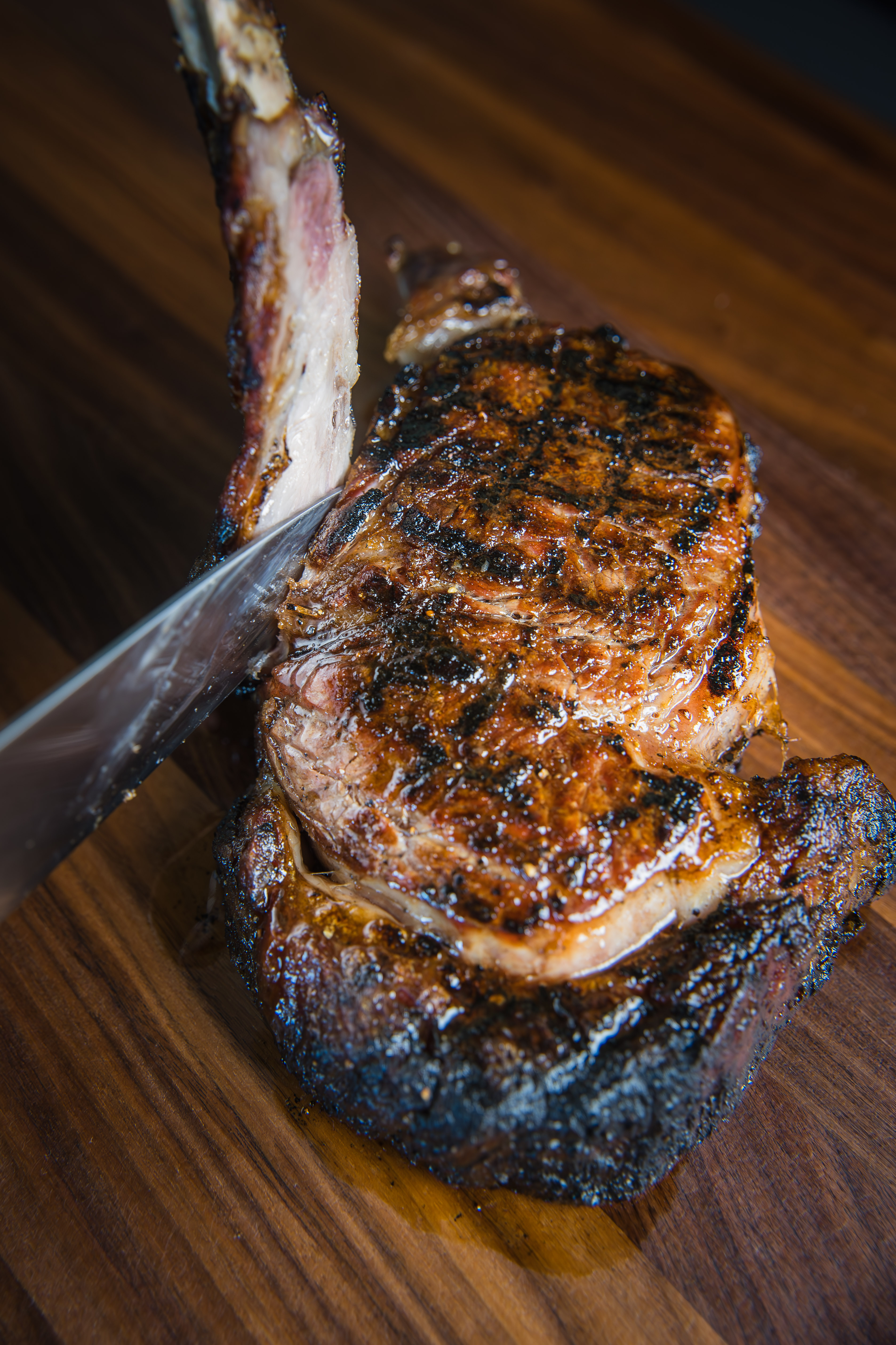 a piece of cake sitting on top of a wooden cutting board