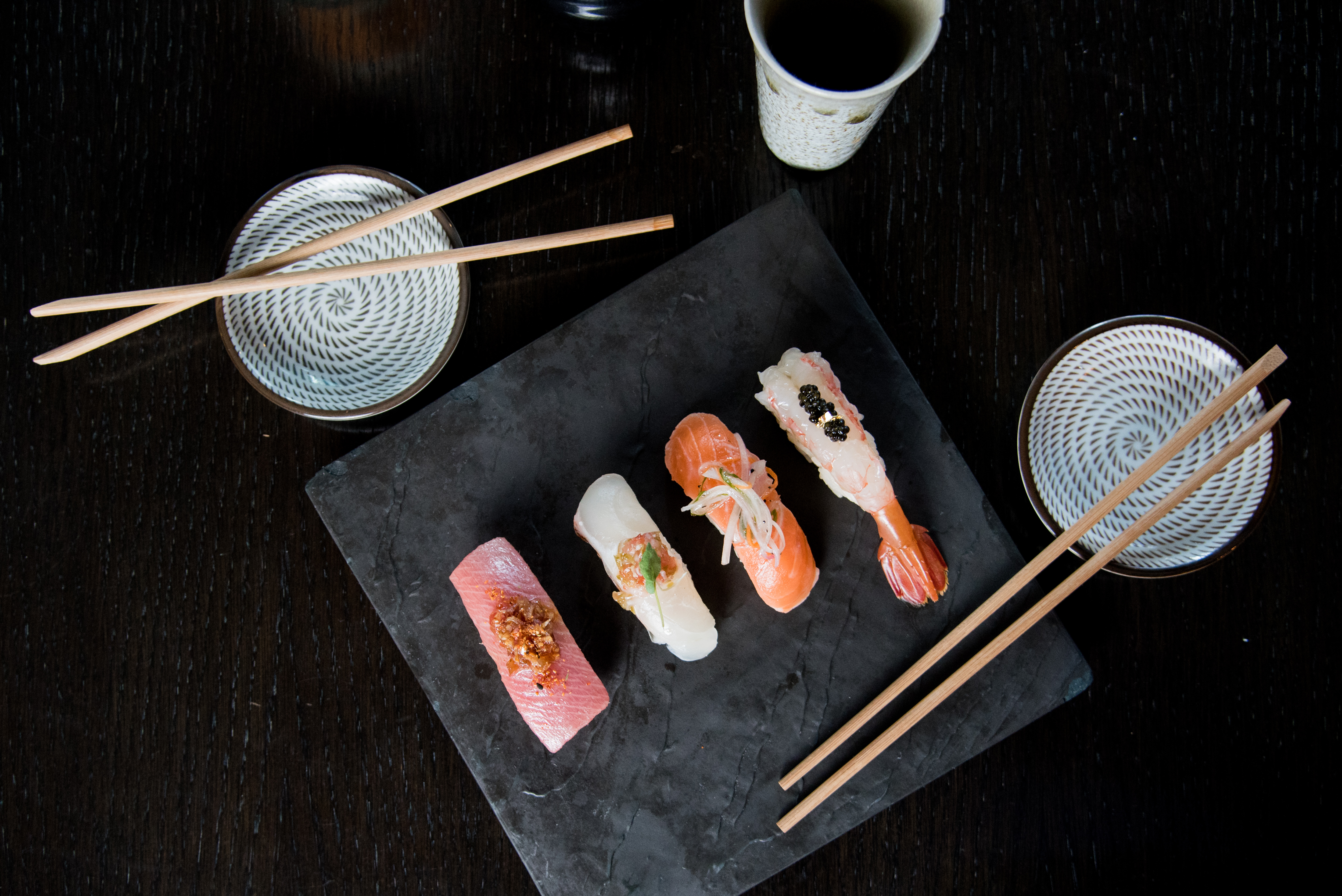 a slice of pizza sitting on top of a wooden table
