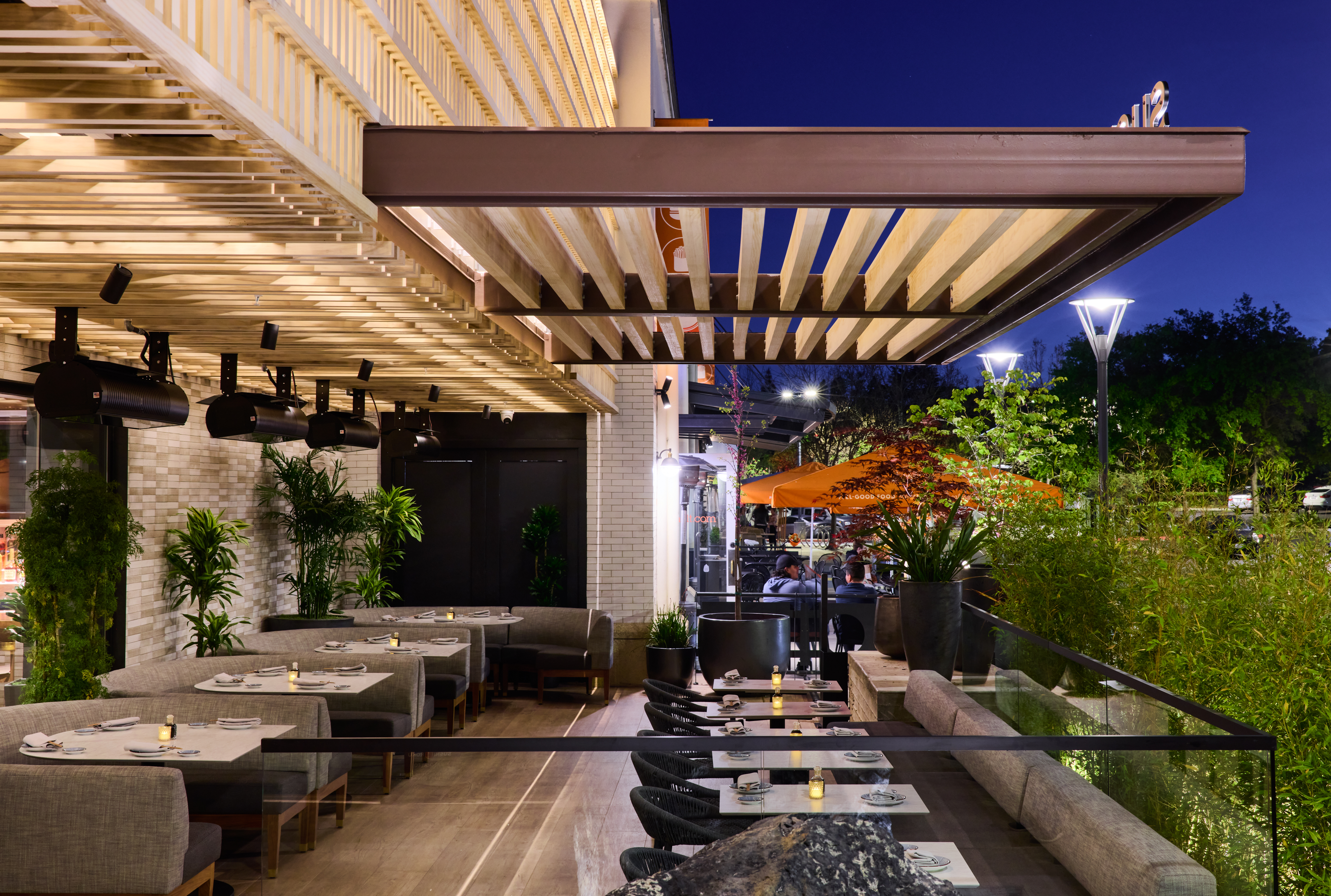 a long bench in front of a building