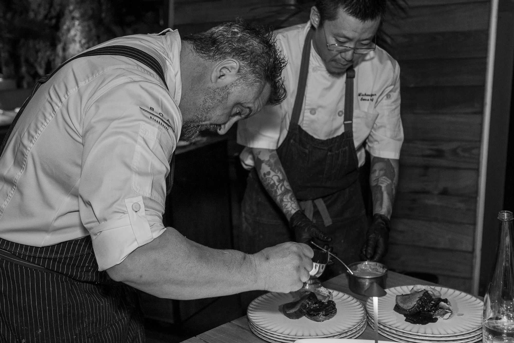a man cutting a cake