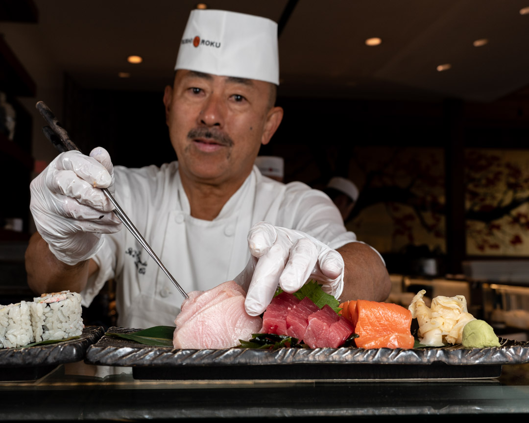 a person holding a plate of food