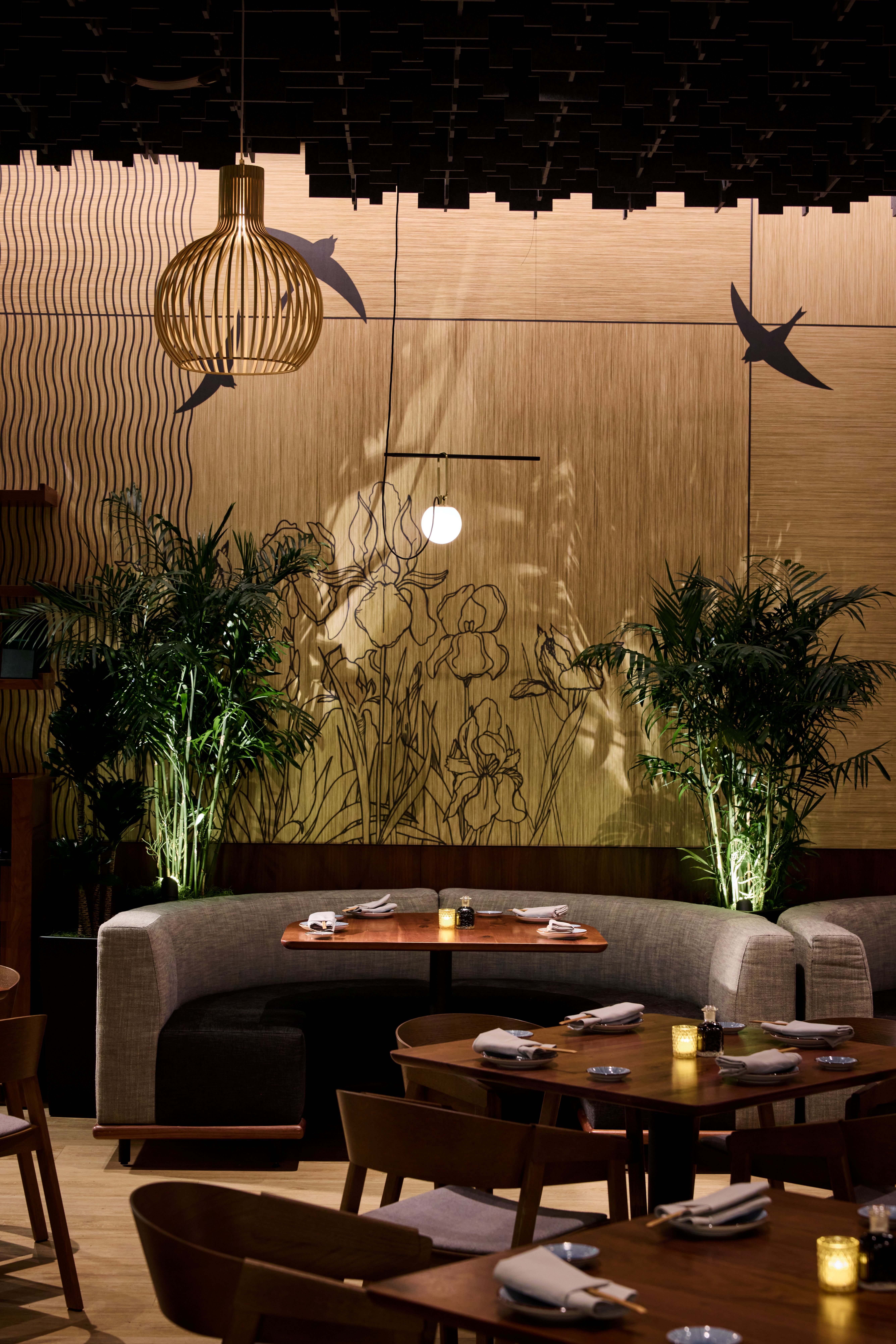 a room filled with furniture and vase of flowers on a table