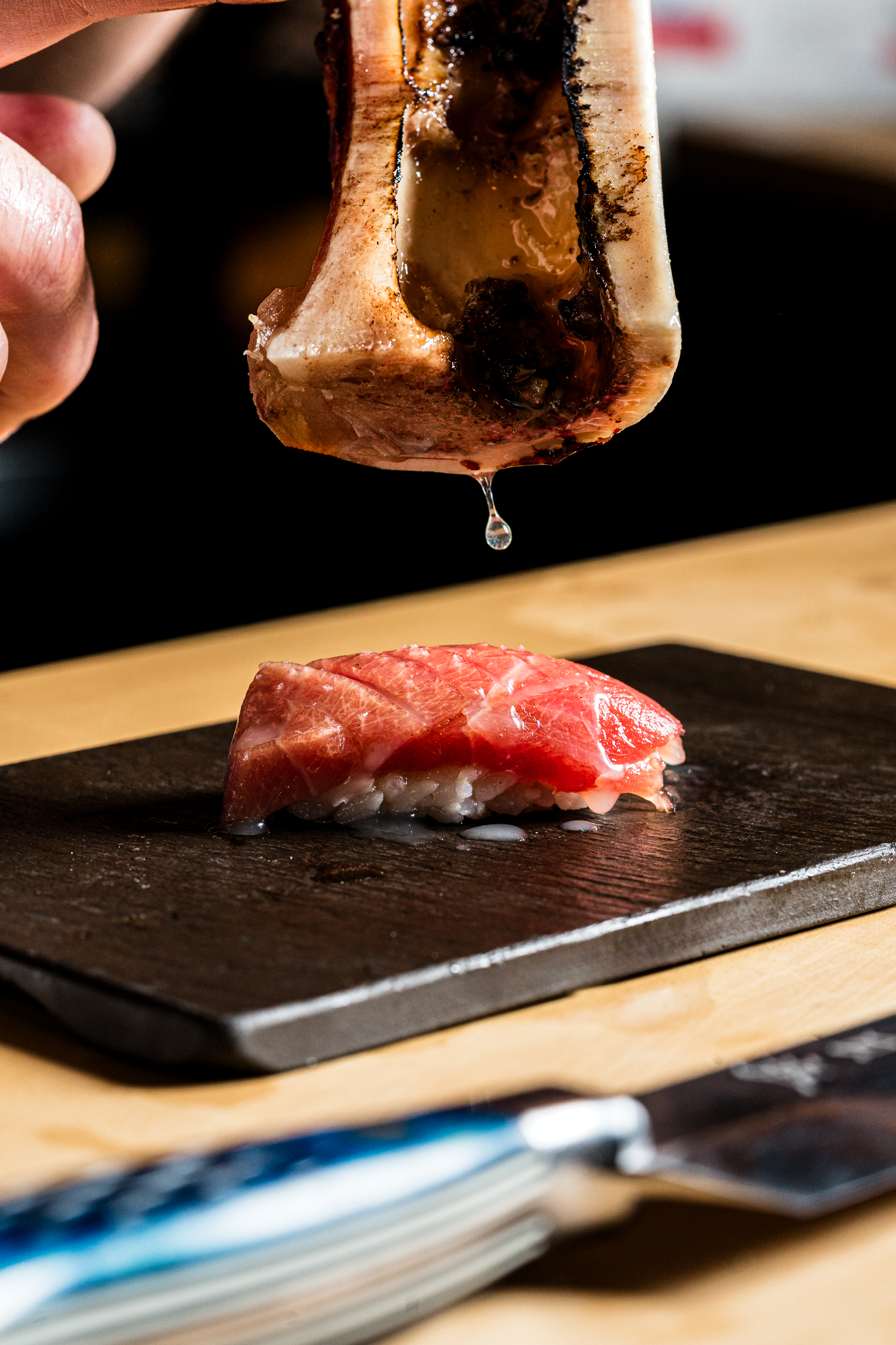 a piece of cake sitting on top of a wooden cutting board