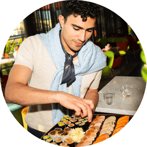 a man eating sushi