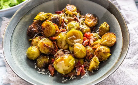 Fried brussels sprout with roasted bacon and parmesan cheese.