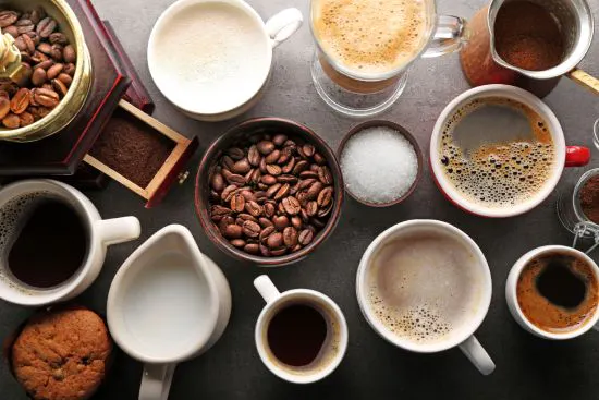 Group of coffee cups with liquid and coffee grains