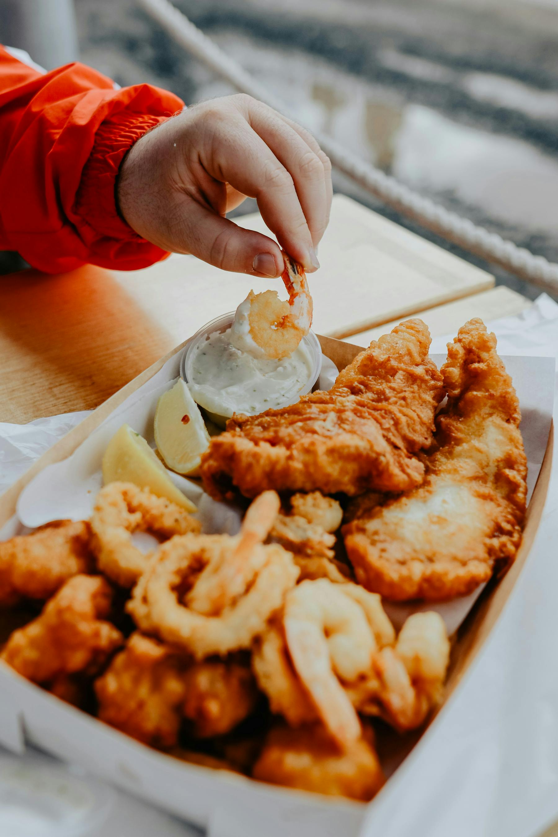 a person holding a plate of food