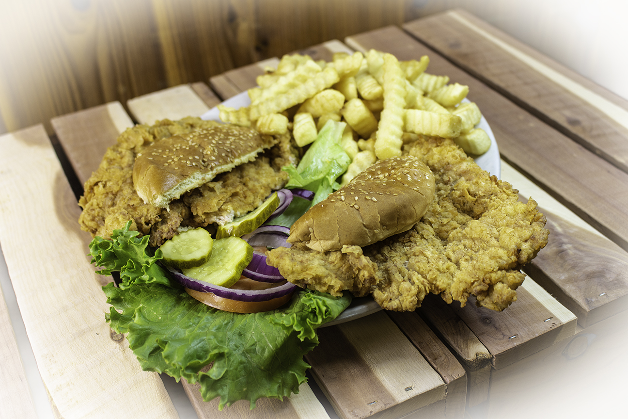 a sandwich sitting on top of a wooden table