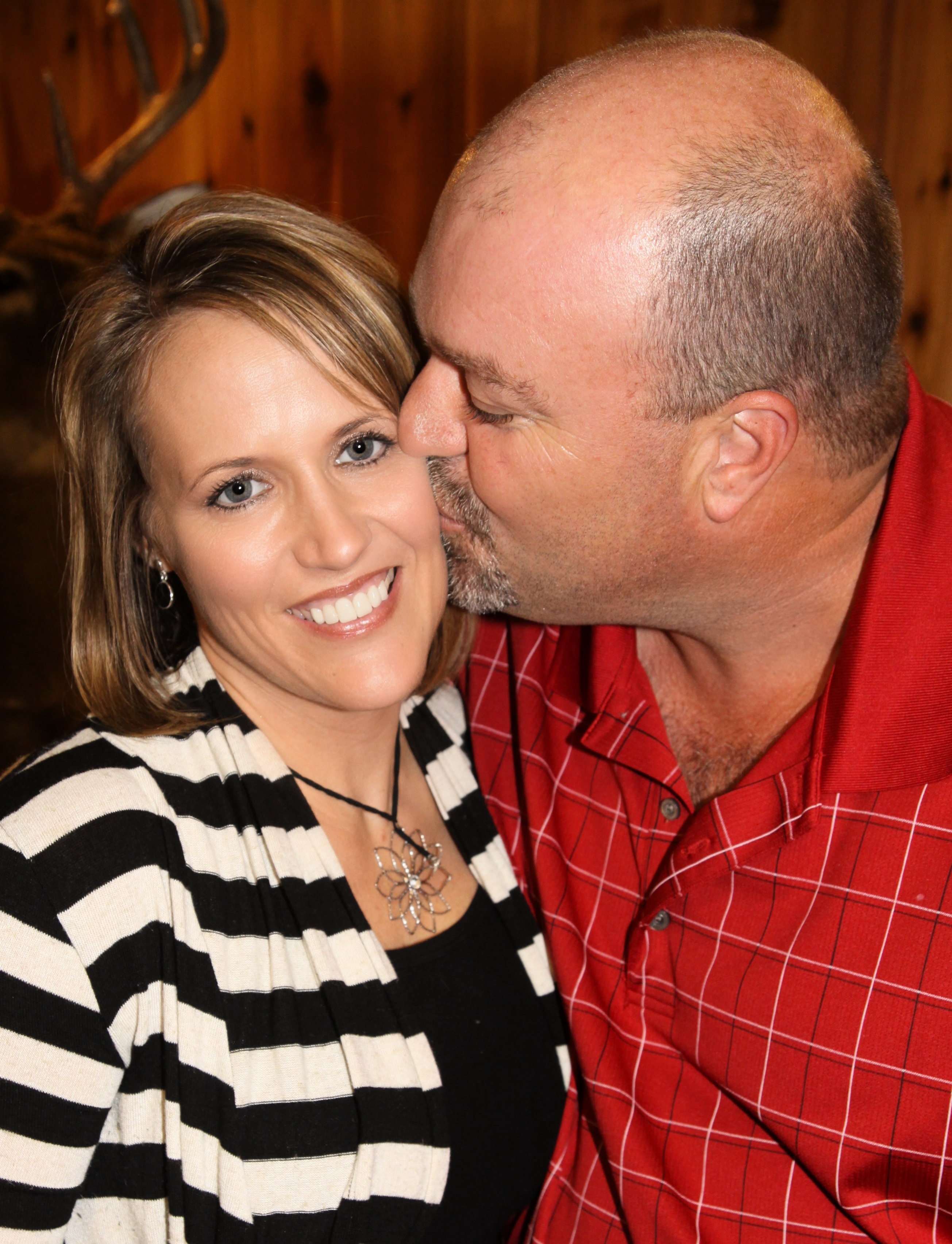 a man and a woman looking at the camera