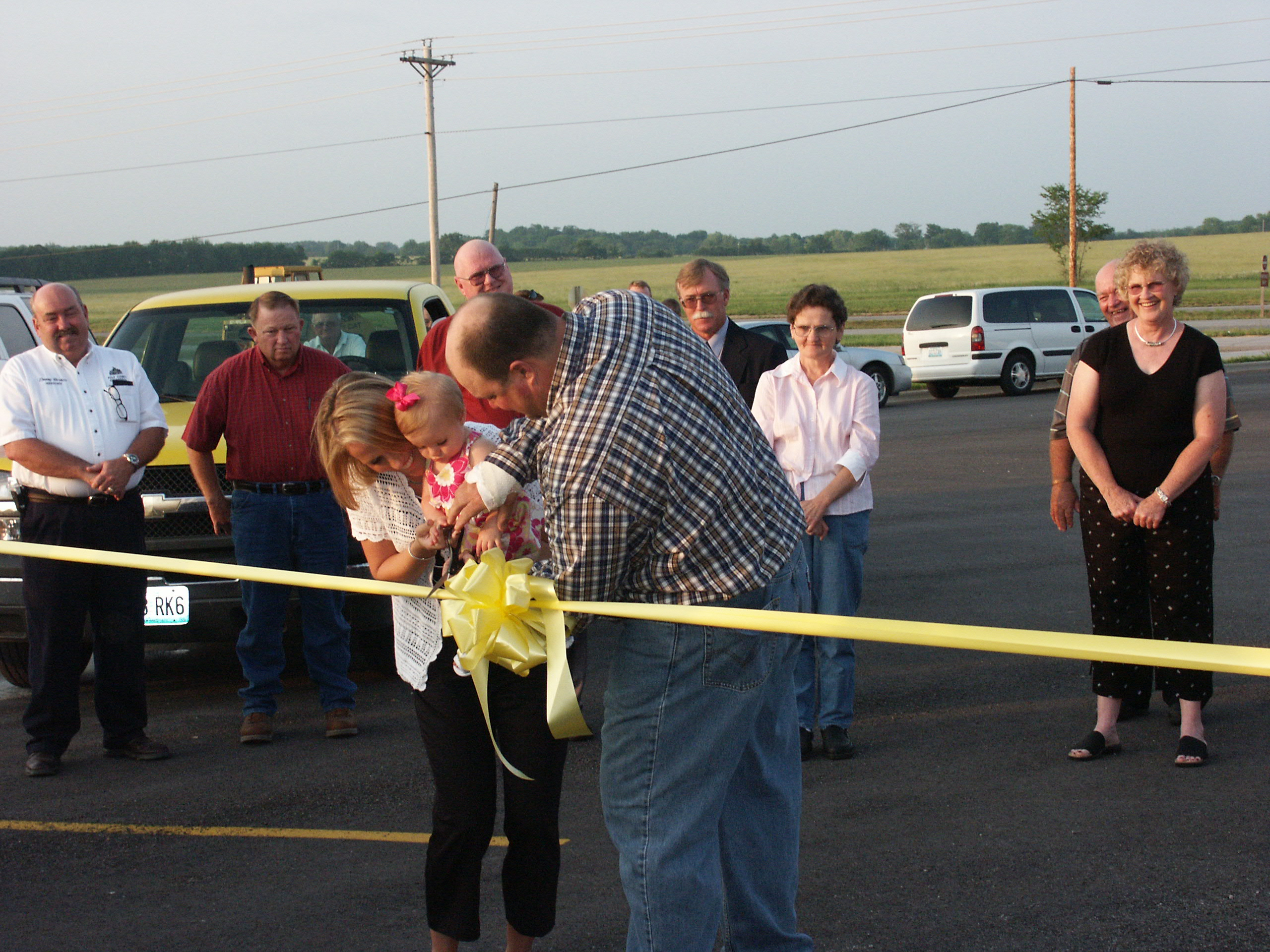John R. Bolton et al. standing in a parking lot