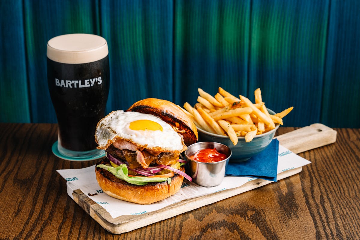 a plate with a sandwich and a cup of coffee