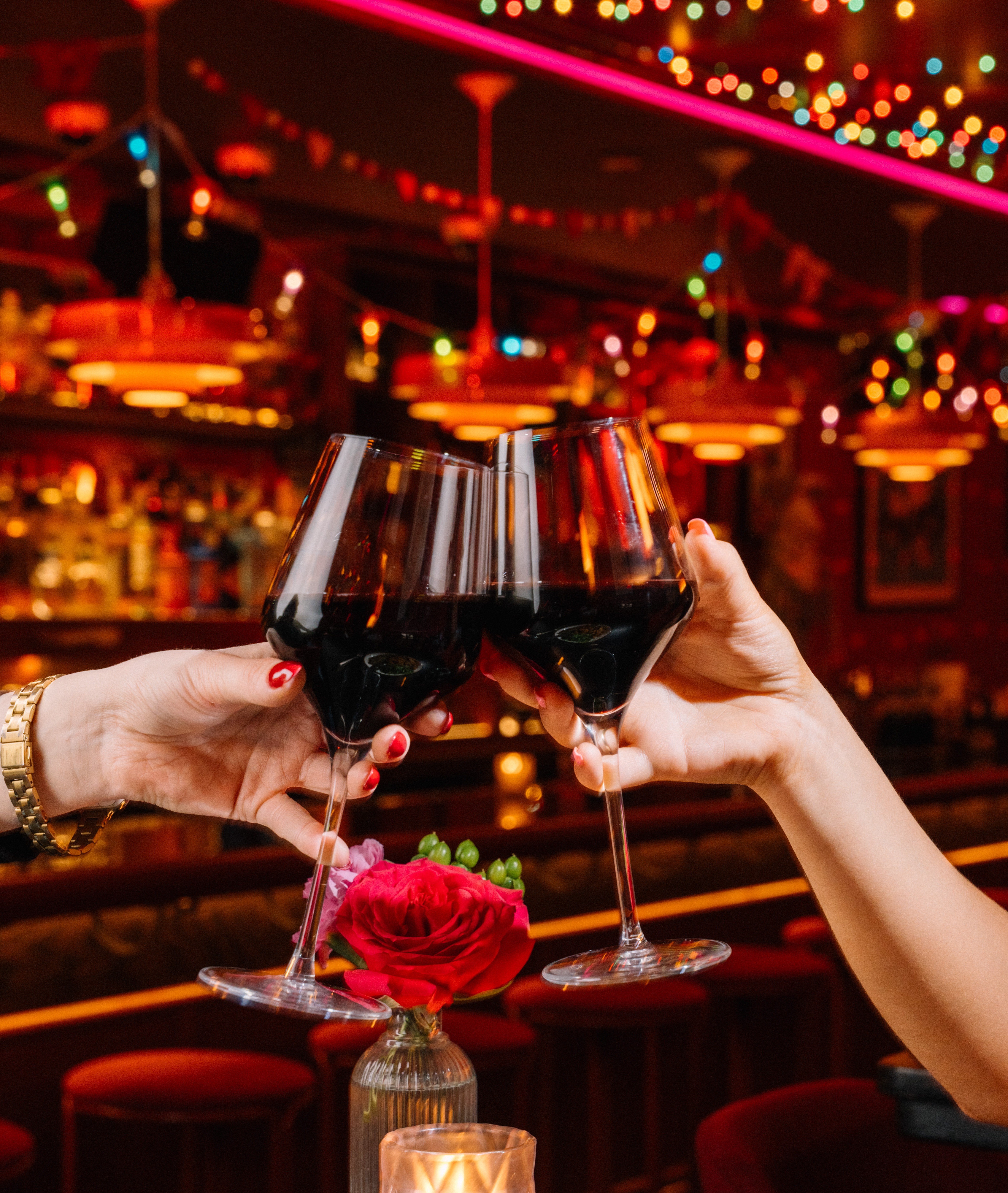 a person holding a glass of wine