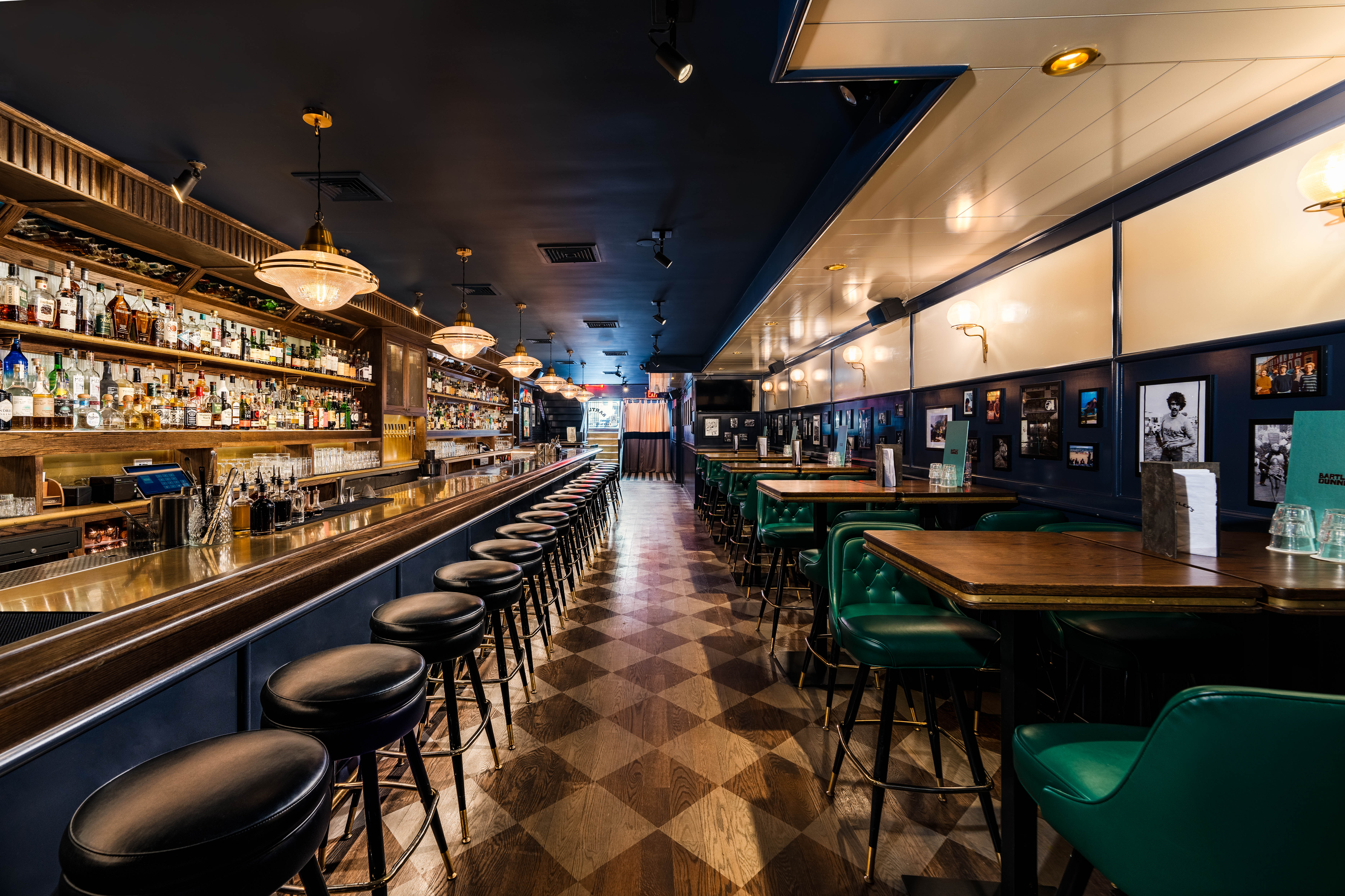 a bar with tables and stools