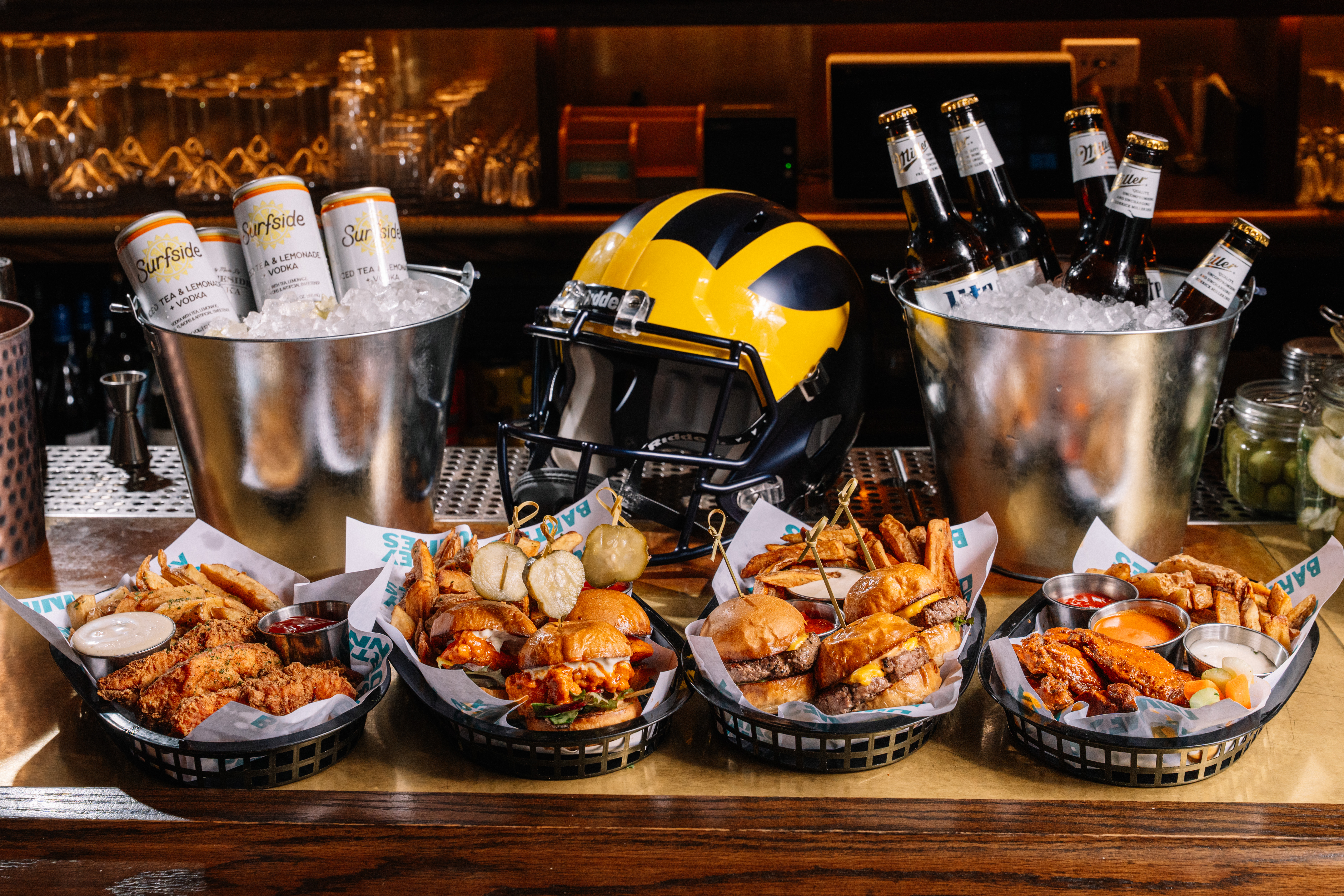 a table topped with plates of food on a counter