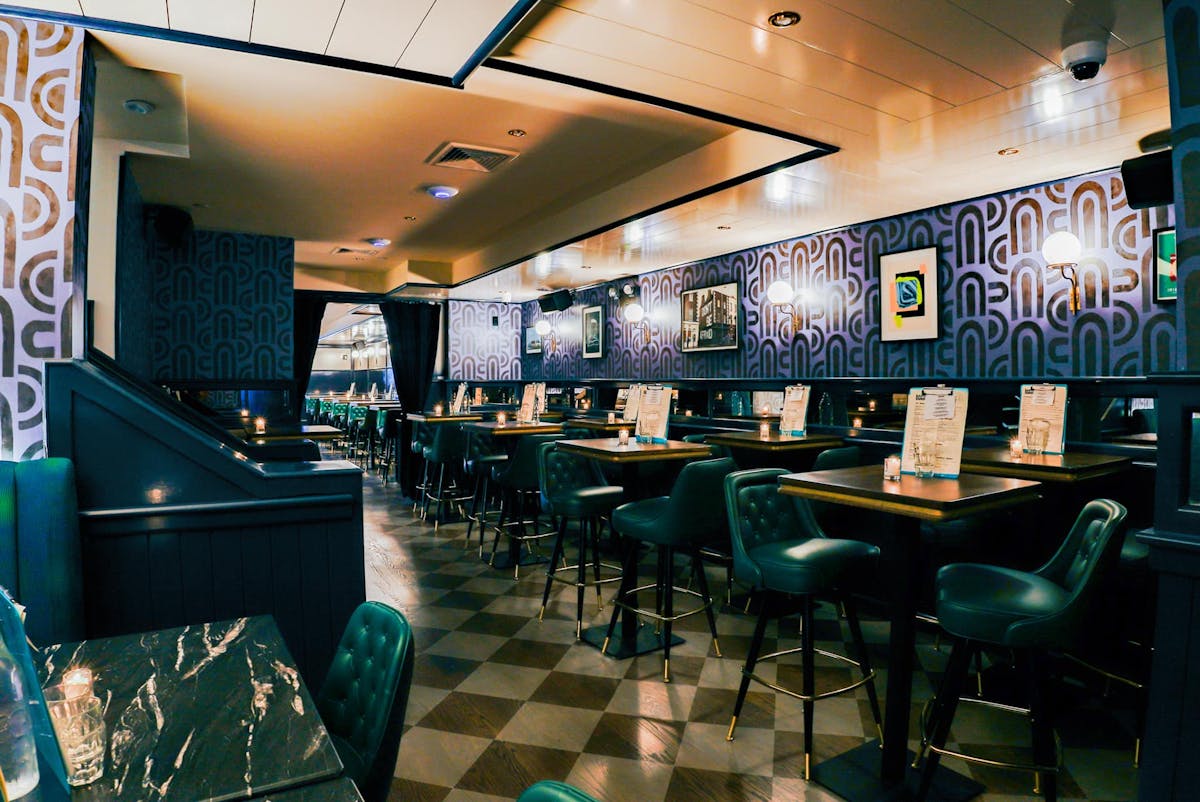 a room filled with furniture and a table in a restaurant