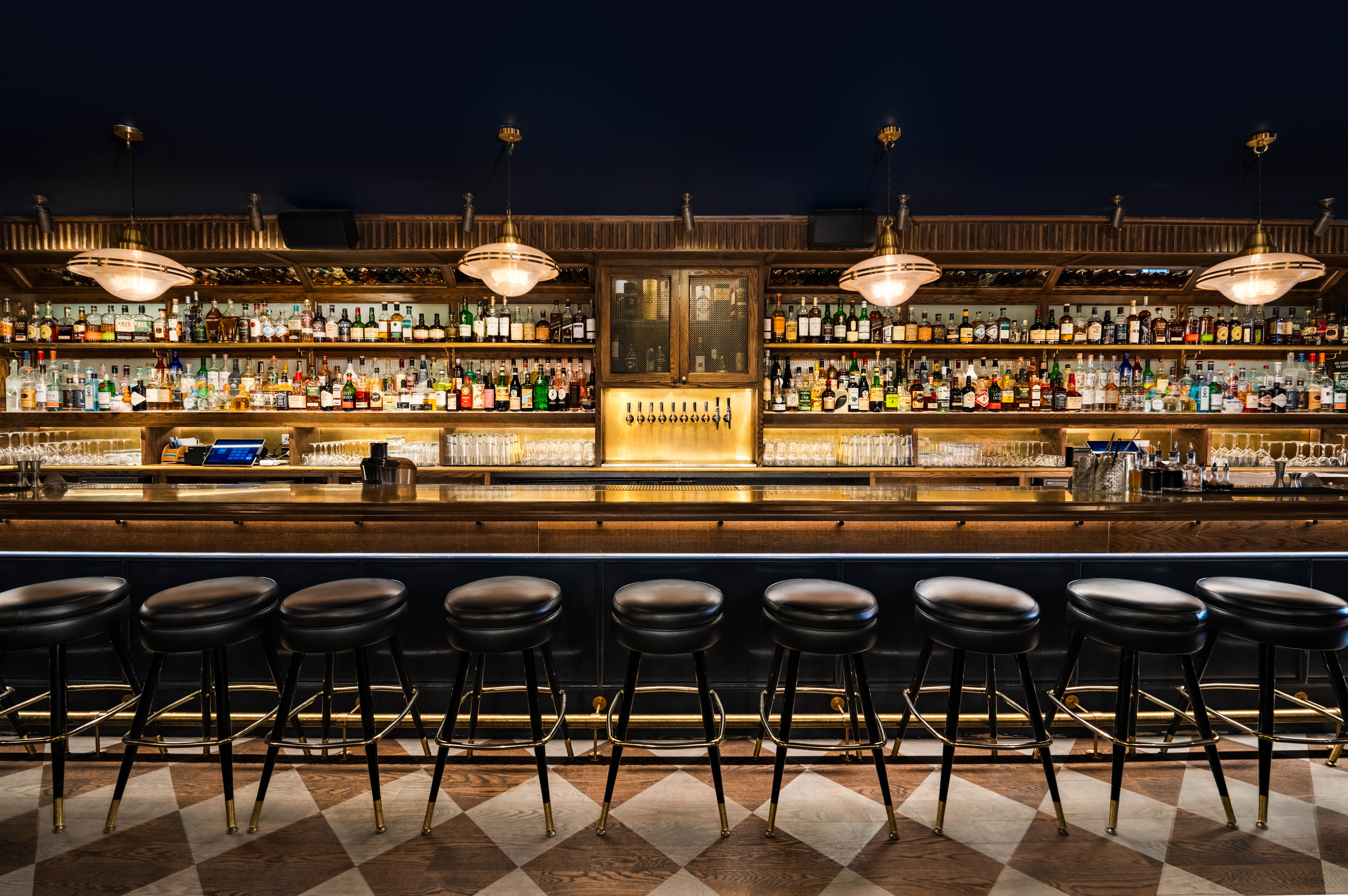 a bar with a row of stools