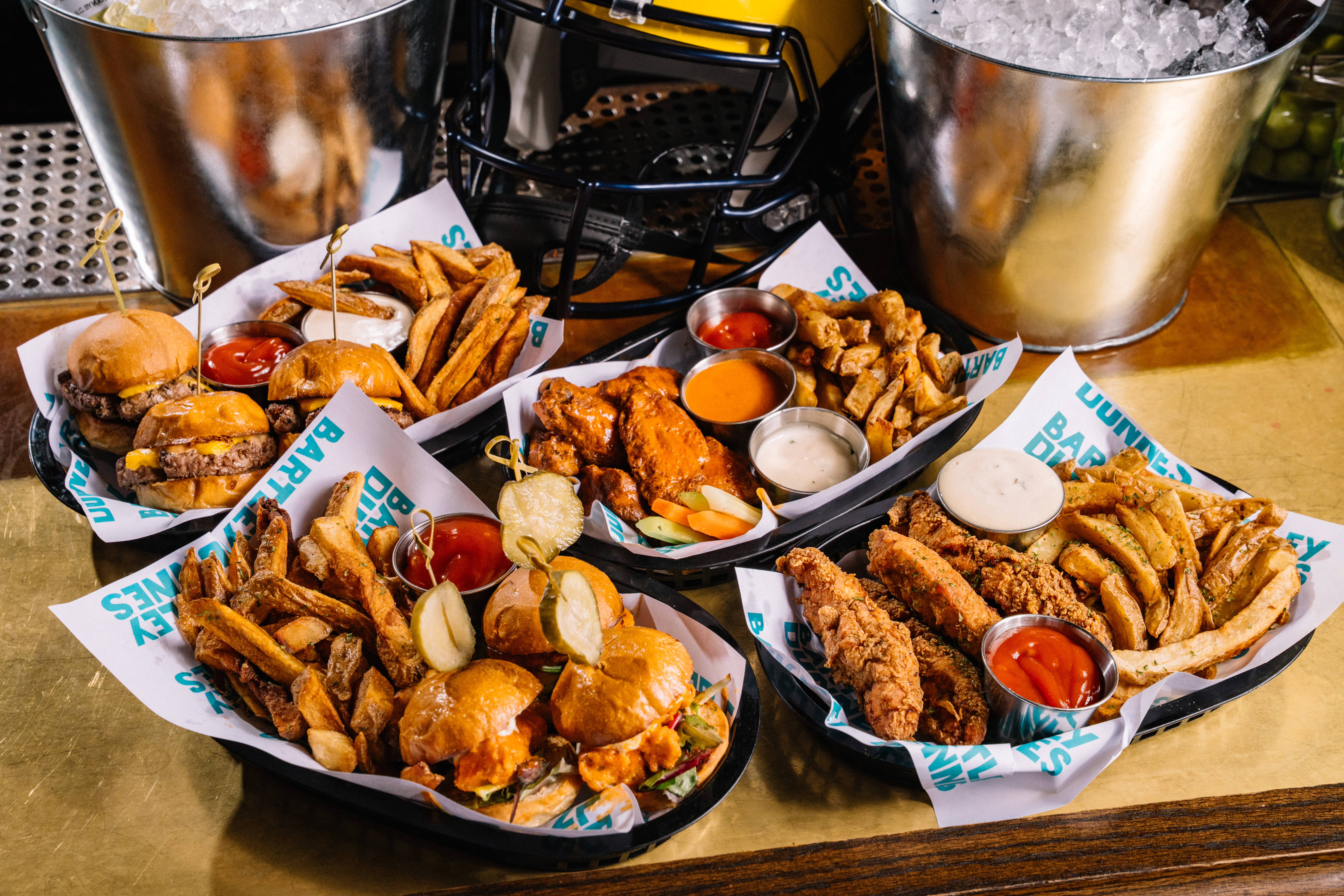 assortment of food including wings, sliders and tenders