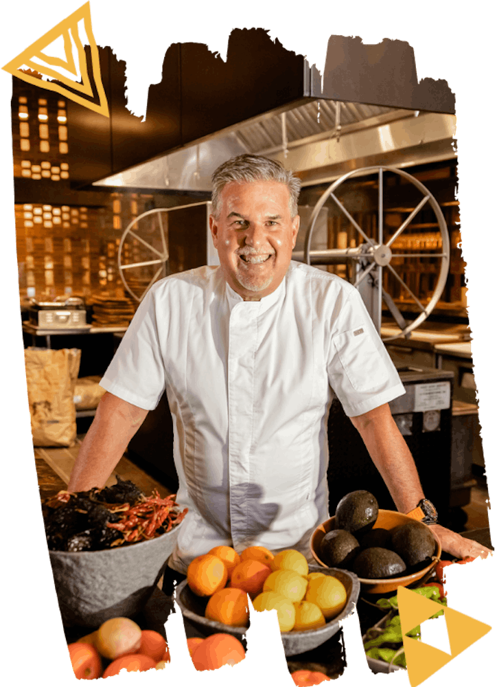 a man sitting at a table with food